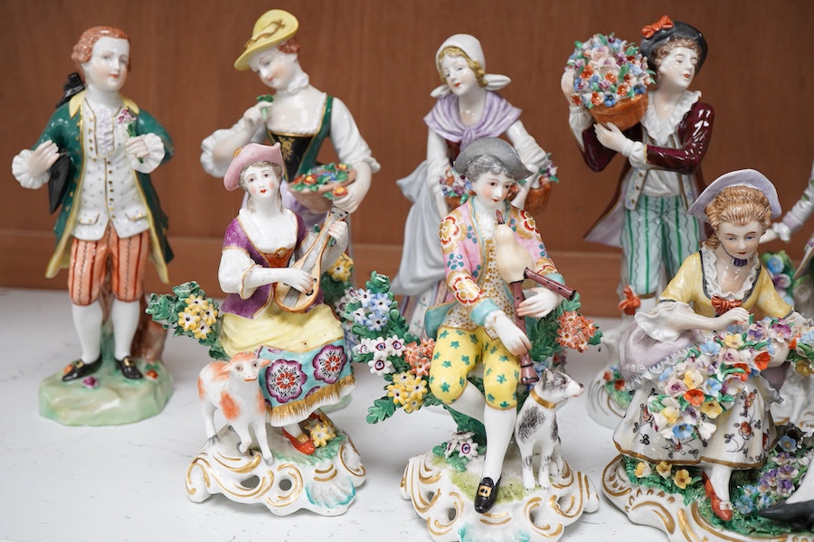 Four pairs of porcelain figures, a single figure and seated figure group, all after Chelsea and Derby originals, together with a Meissen style schneeballen porcelain sucrier and cover, (12)